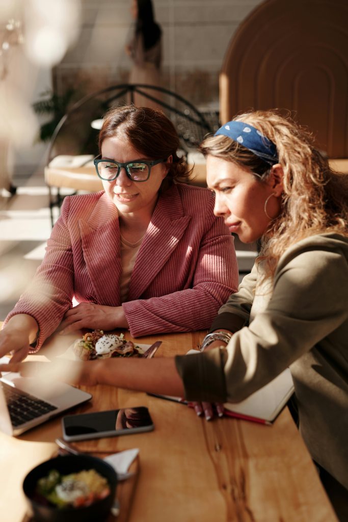 two workers looking at pc